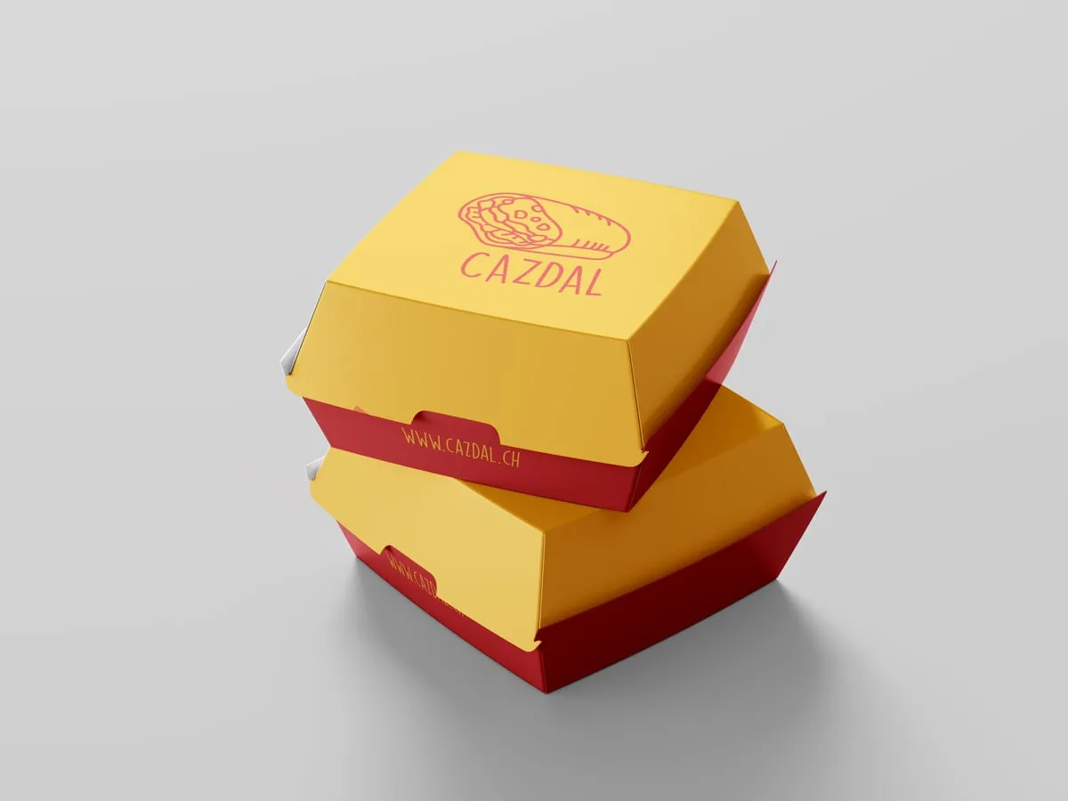 Deux boîtes à burger jaunes et rouges aux couleurs de Cazdal